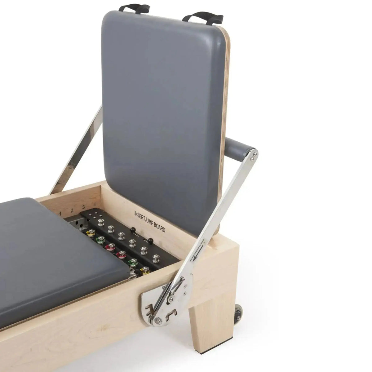 Elina Pilates Elite Reformer mit Tower aus Ahornholz, Detail des Fachs unter der hochgeklappten Kopfstütze mit Federn