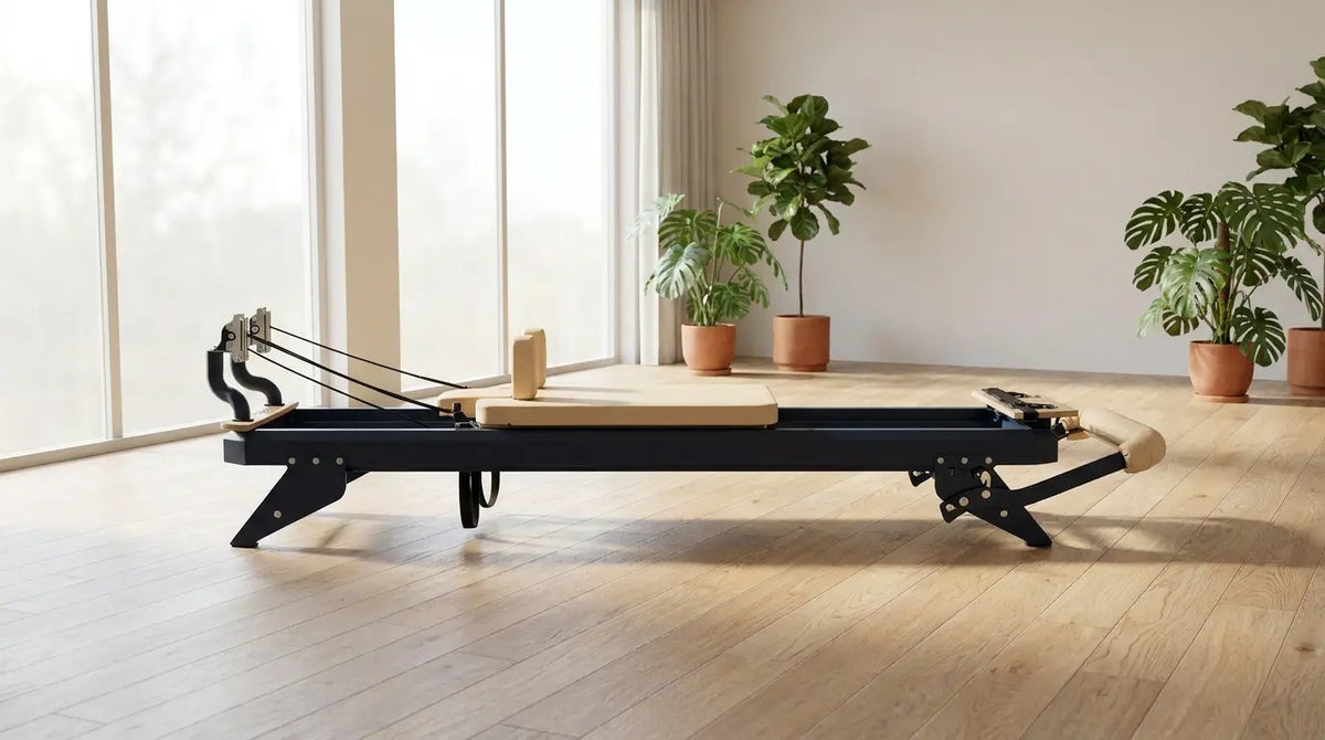 Hegren TALMA 62 Reformer with a steel frame in a bright, modern Pilates studio