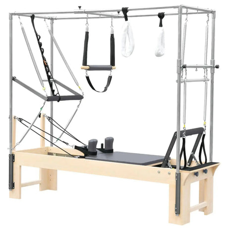 Elina Pilates Cadillac Reformer aus Rock-Ahorn – Schrägansicht mit Trapezrahmen und Polstern in Grau