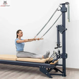 Hegren Pilates Stick 1,10 m mit Verbindungsgliedern im Einsatz, Übung im Sitzen am Reformer-Turm
