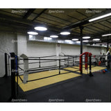 SportCom Ecofix Bodenmontage-Boxring auf gelber Mattenfläche in einem Boxstudio