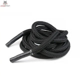 tiguar Battle Rope V2 Trainingsseil in Schwarz, locker gewickelt mit Griffenden vorne, Seitenansicht