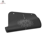 tiguar Yoga-Basismatte Marine Yogamatte in der Farbvariante Graphit, halb aufgerollt mit Mandala-Motiv