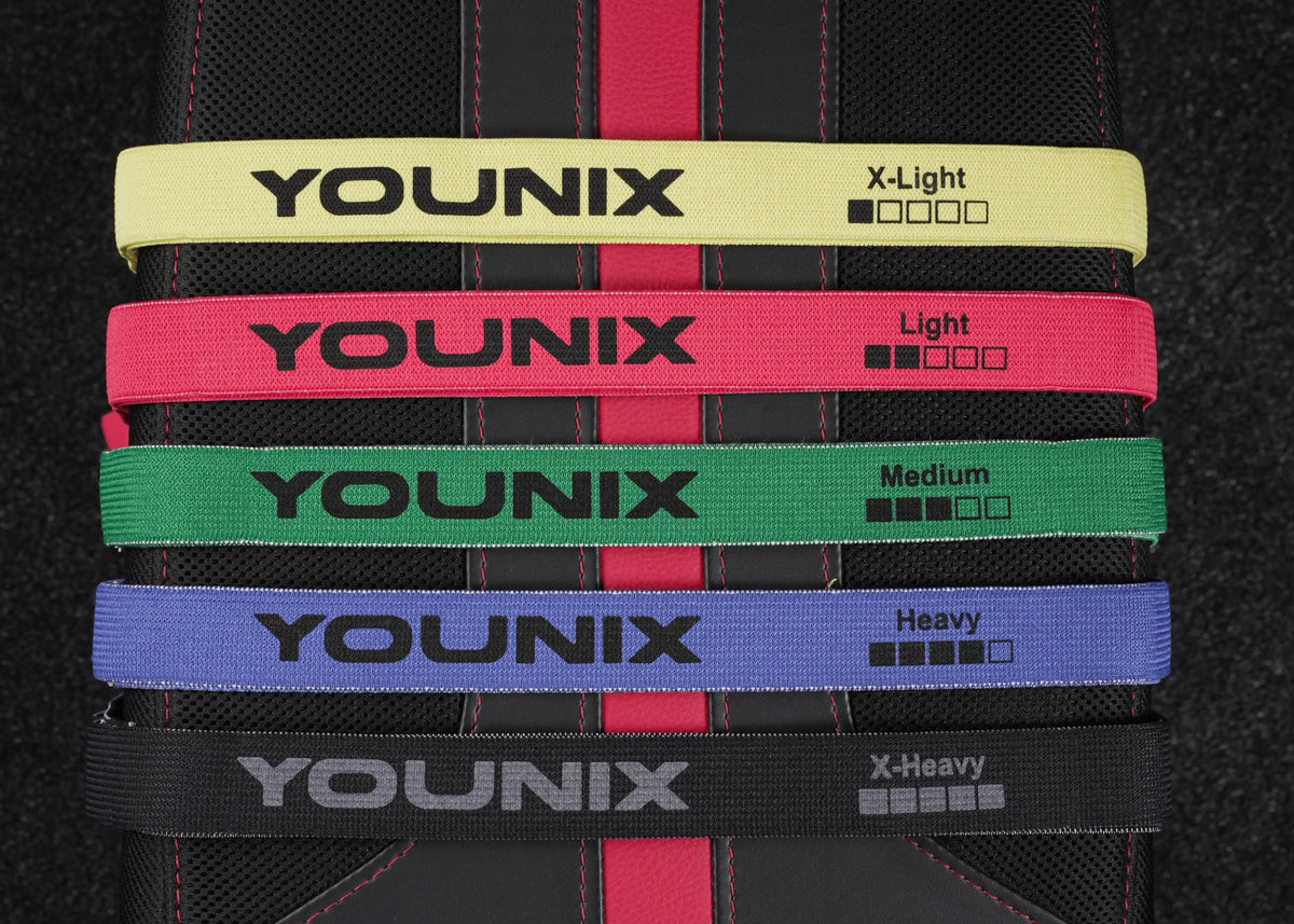 Younix Fabric Elastic Band X-Light Widerstandsband, fünf Stoffbänder in allen Stärken übereinander auf dunklem Grund
